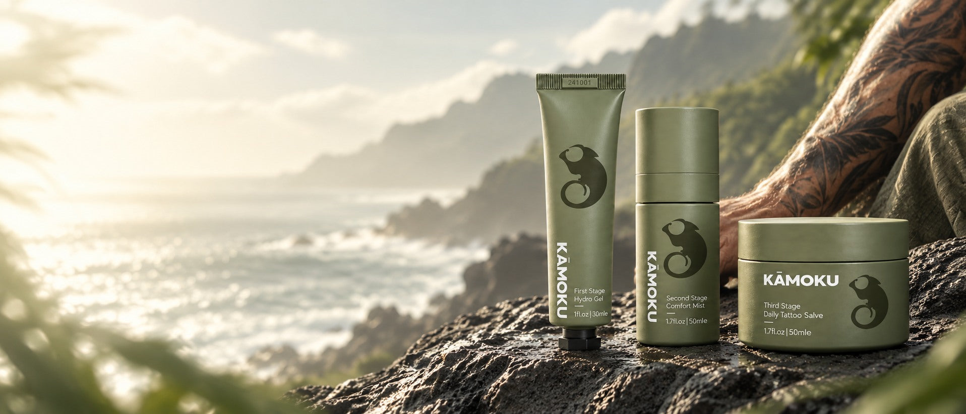 KĀMOKU Hydro Gel, Comfort Mist and Daily Tattoo Salve on volcanic stone above the Pacific